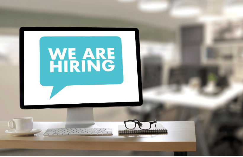computer with we are hiring sign