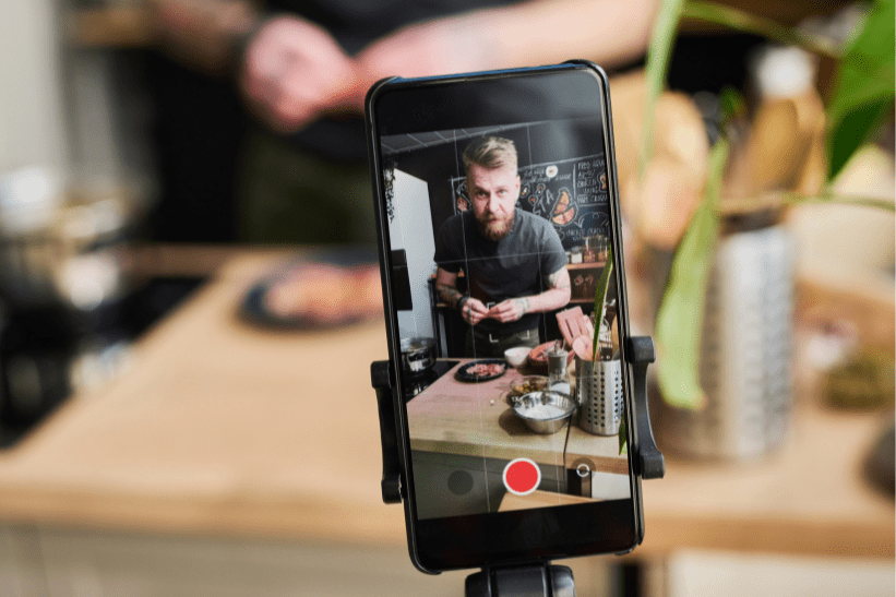 man making a viral video on his phone